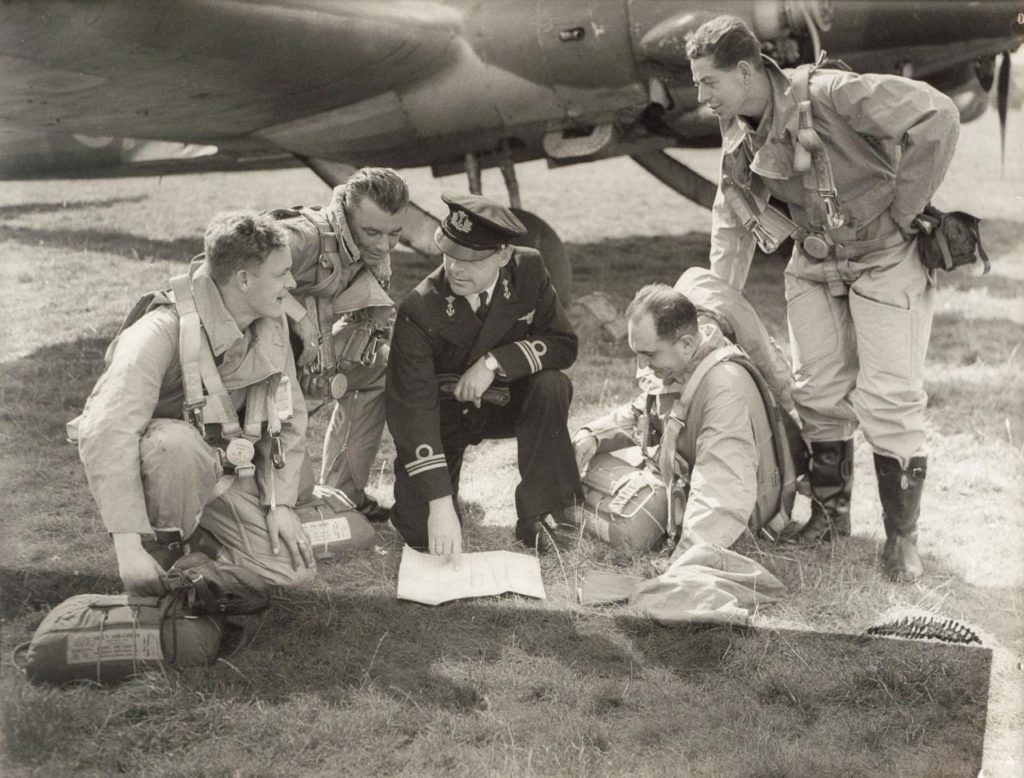 WW2 airmen planning their next mission